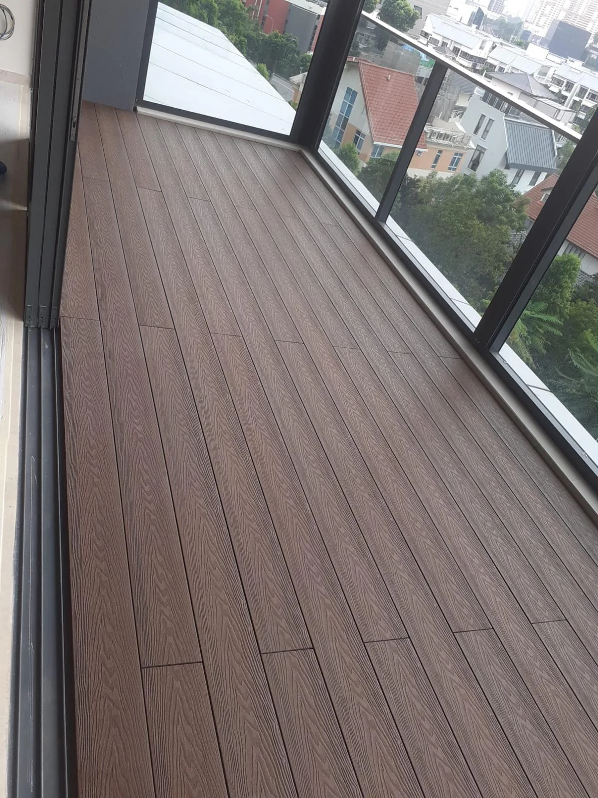 Deck to the glazing, decking installed by Exterior Design in Singapore
