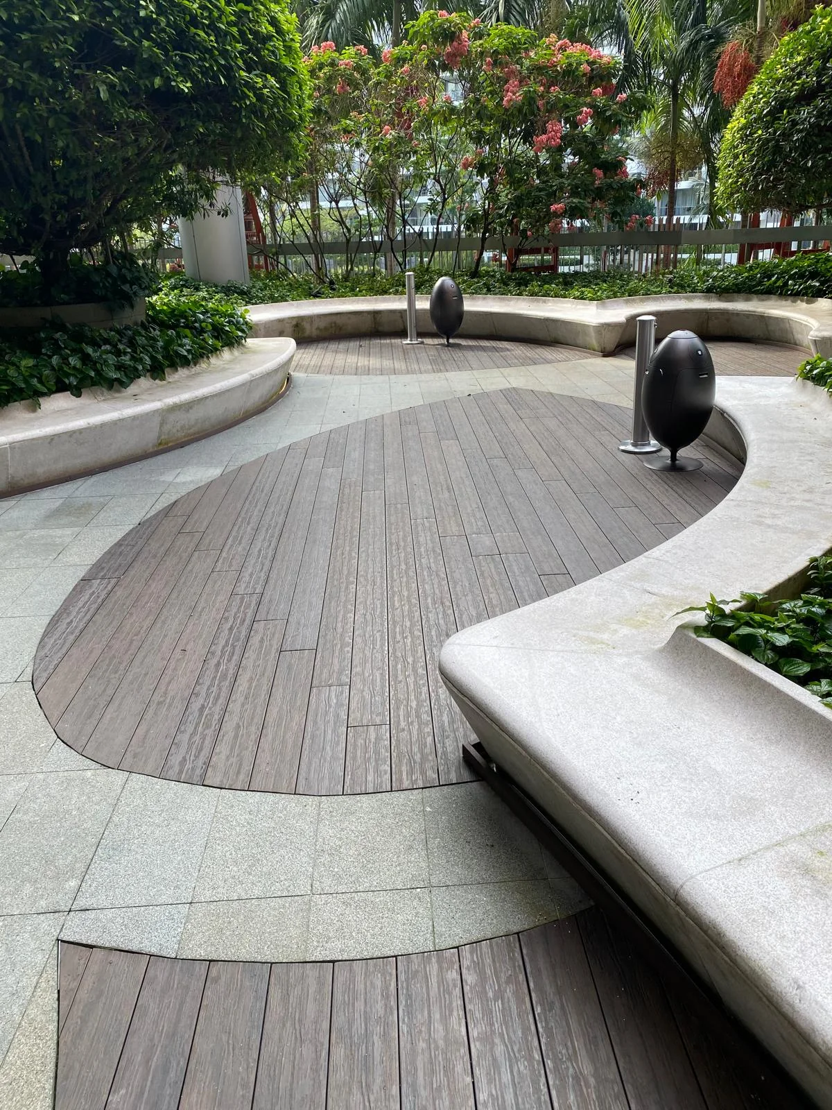 WPC composite decking laid in a curved garden terrace in Singapore
